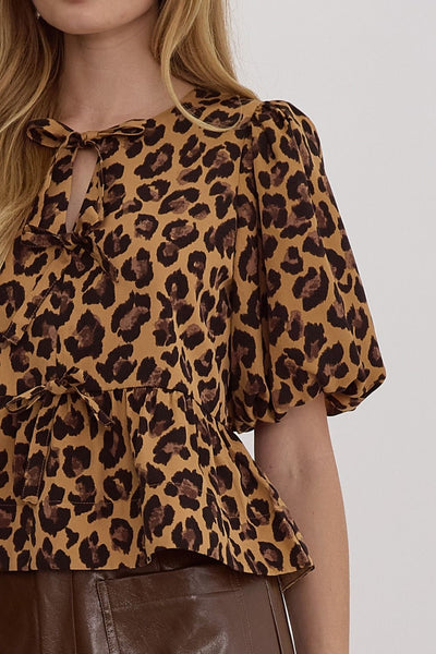 the Hezly Bow tie animal print peplum top